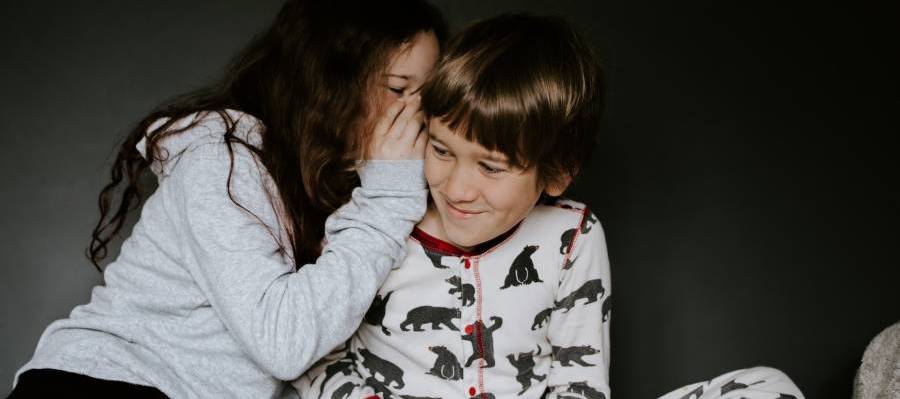 children whispering together