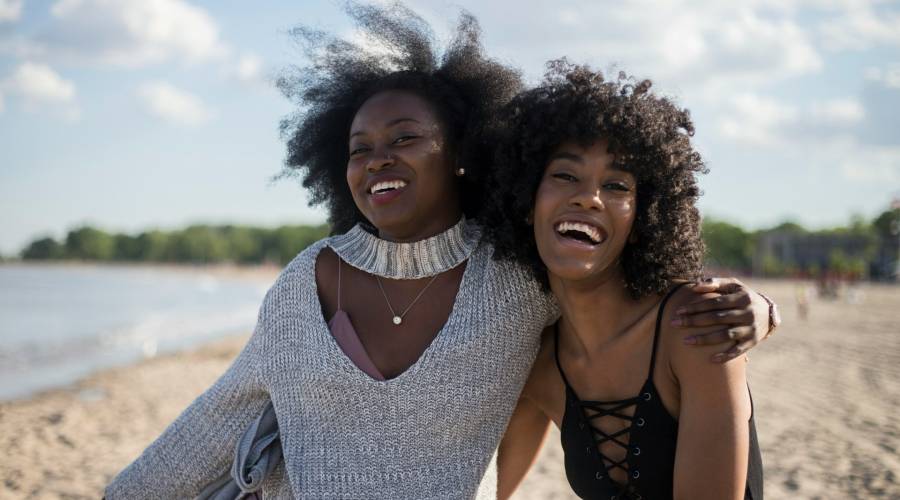 friends laughing on beach friends laughing on beach
