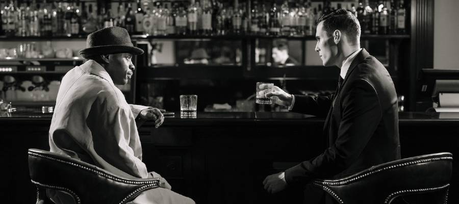 two men at bar, photo in style of noir movie
