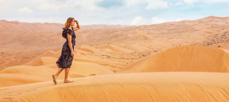 woman walking in desert