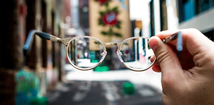 view of street through eyeglasses