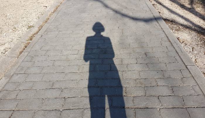 shadow on sidewalk, representing mysterious story ideas