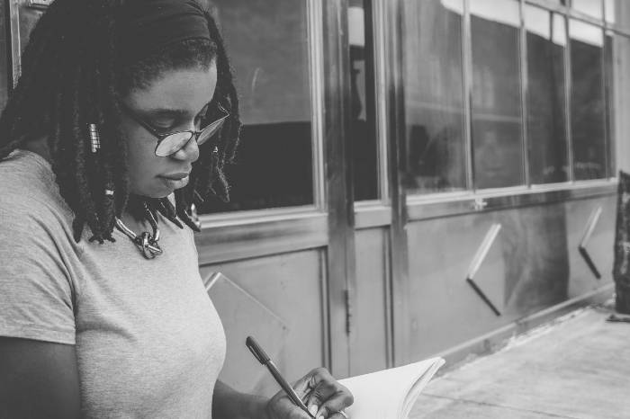 woman writing down ideas for novels woman writing down ideas for novels