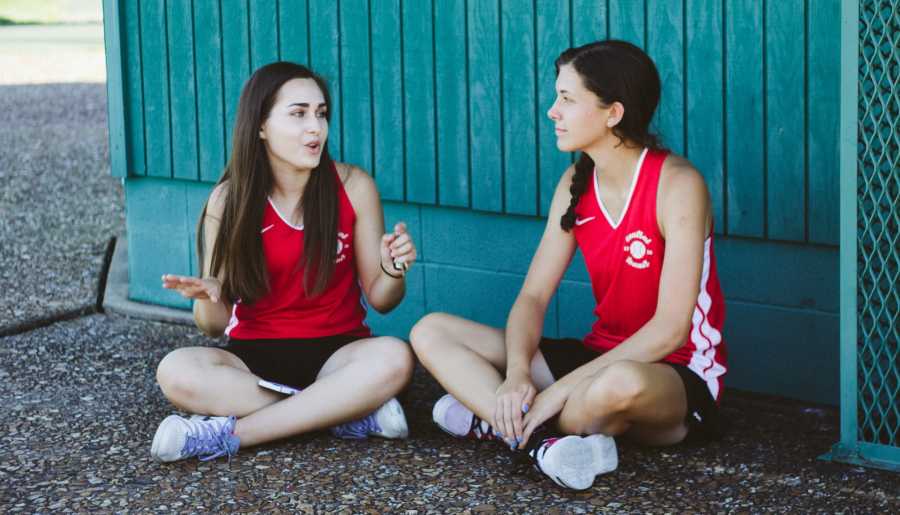 Two young women are having a conversation. two girls talking