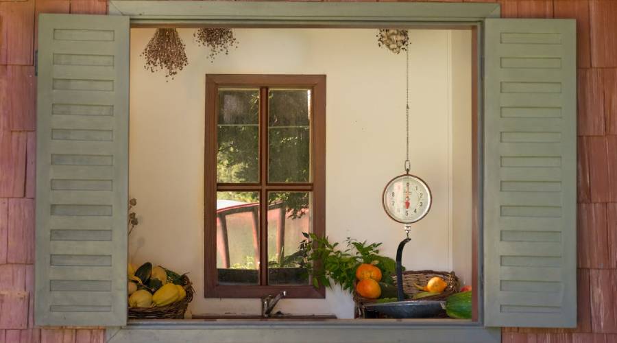 kitchen window with clock, fruit, and dried flowers kitchen window with clock, fruit, and dried flowers